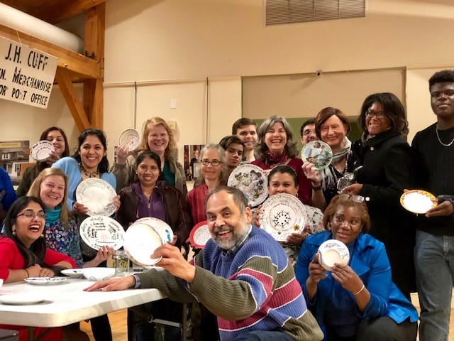 Participants displaying their artwork at Build a Longer Table