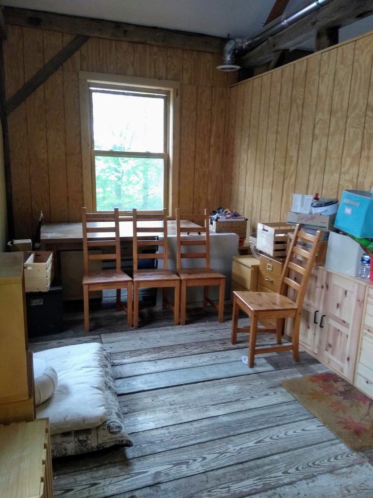 Sunlit south barn artist studio with chairs and work surfaces