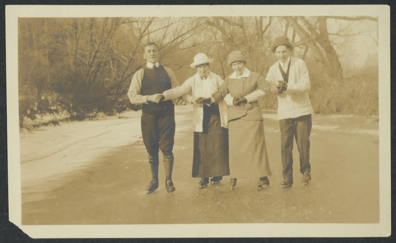Four people standing together outdoors