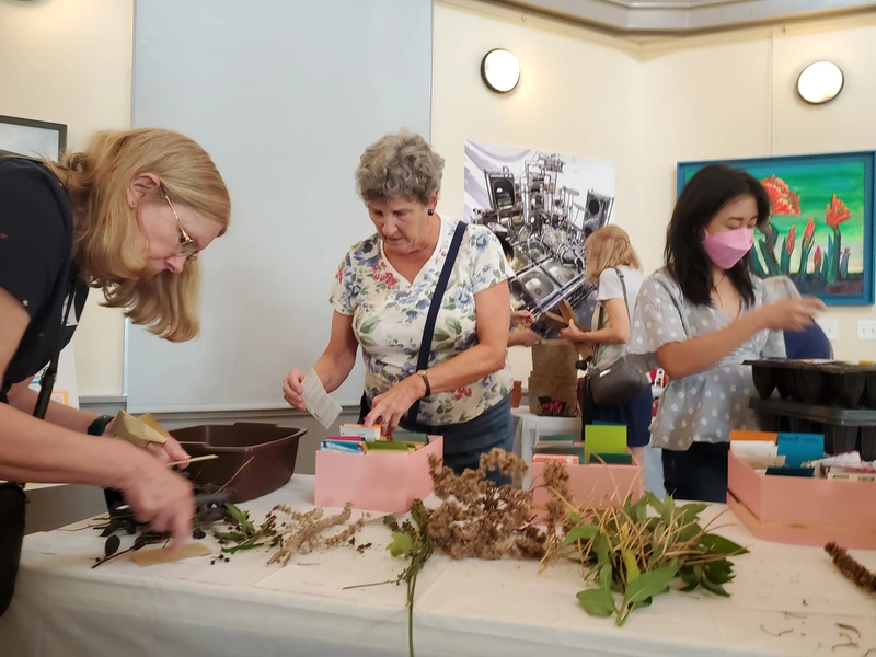 Garden Club participants working with plant materials at a workshop