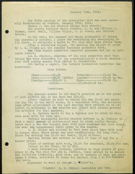 A typed meeting-minutes page with three holes punched along the left edge.