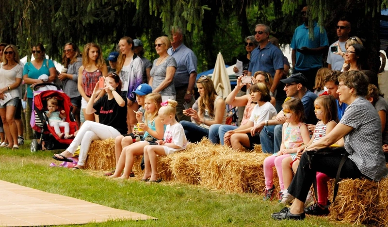 Visitors enjoying an outdoor Strawberry Festival gathering