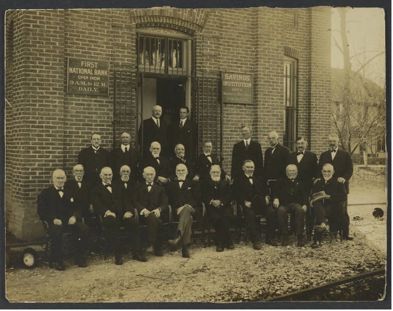 First National Bank directors outside the bank building, 1909.