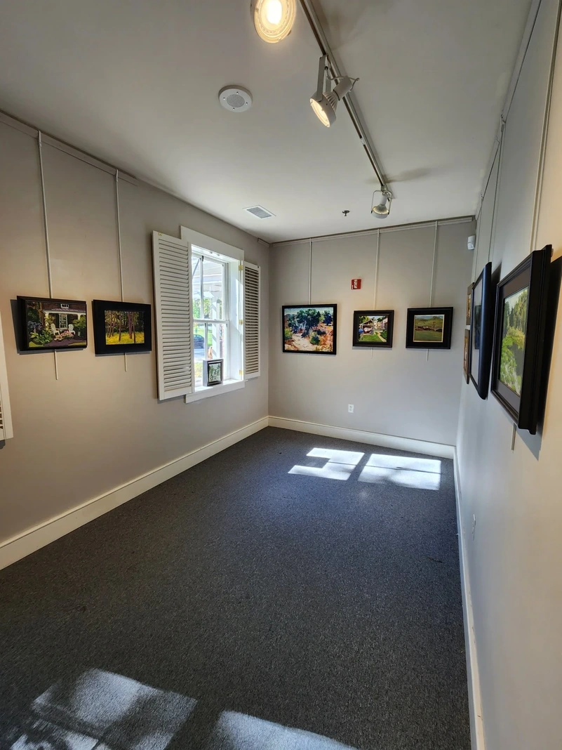 Community Gallery with paintings, windows and shutters