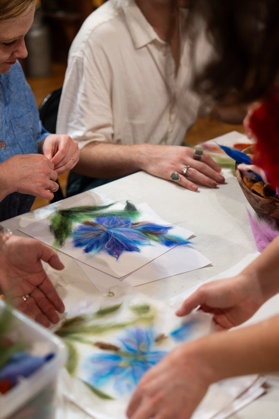 Participants creating Paint with Wool artwork
