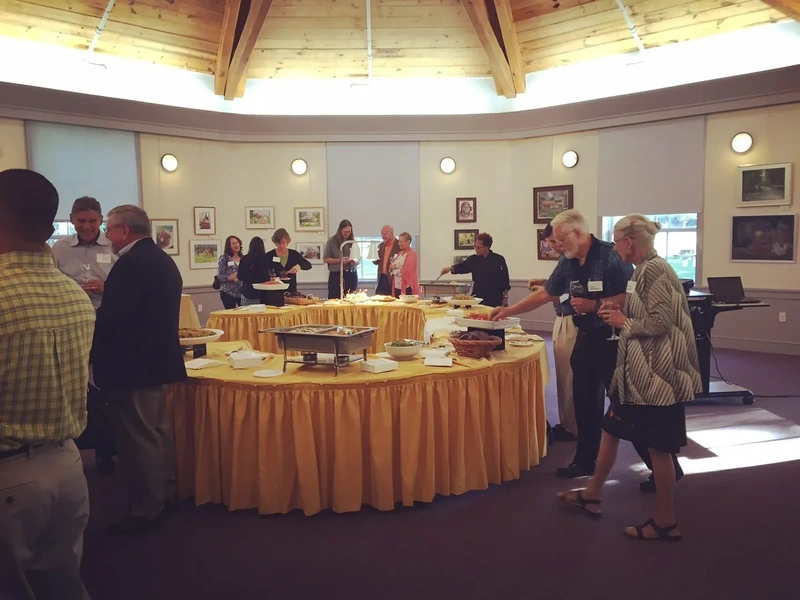 Guests at a buffet in a museum event space