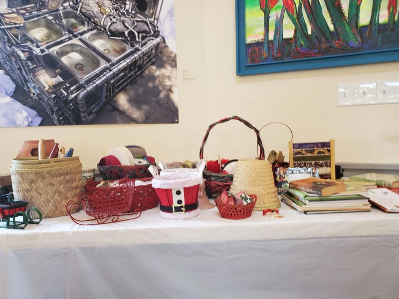Baskets and gardening materials displayed on a workshop table.