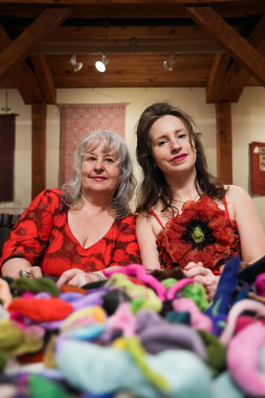 Alla and Milana Borovskaia with colorful wool artwork